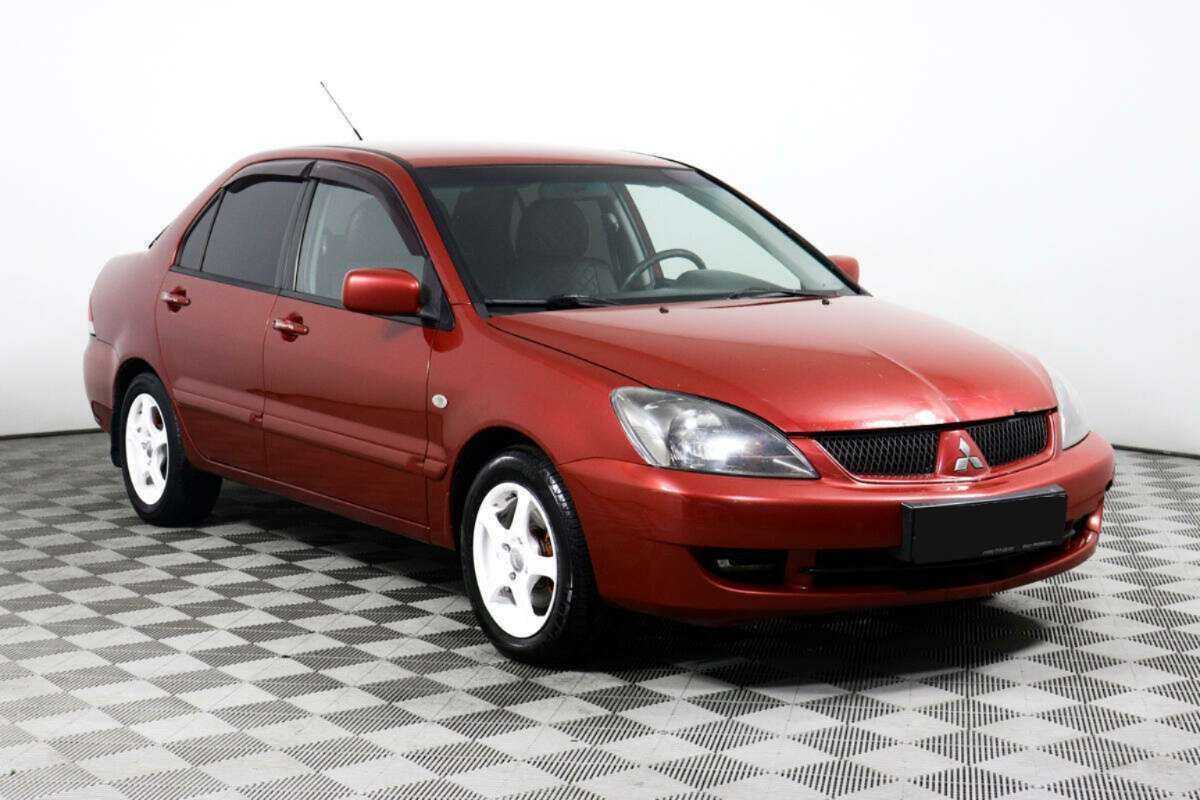 Купить Mitsubishi Lancer с пробегом. Фото: #2