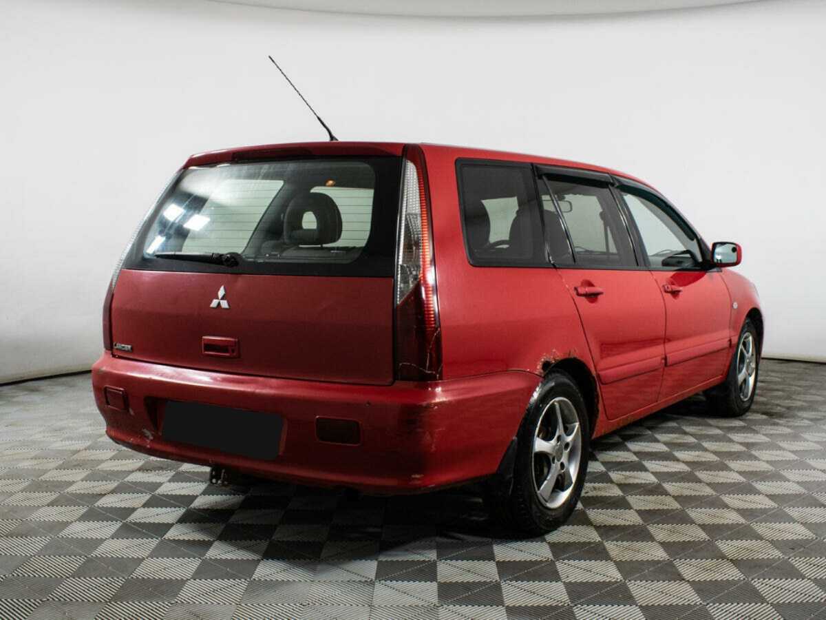 Купить Mitsubishi Lancer с пробегом. Фото: #4
