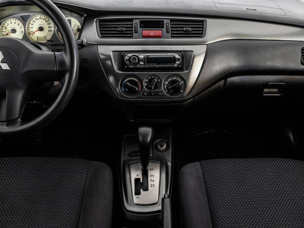 Купить Mitsubishi Lancer с пробегом. Фото: #8