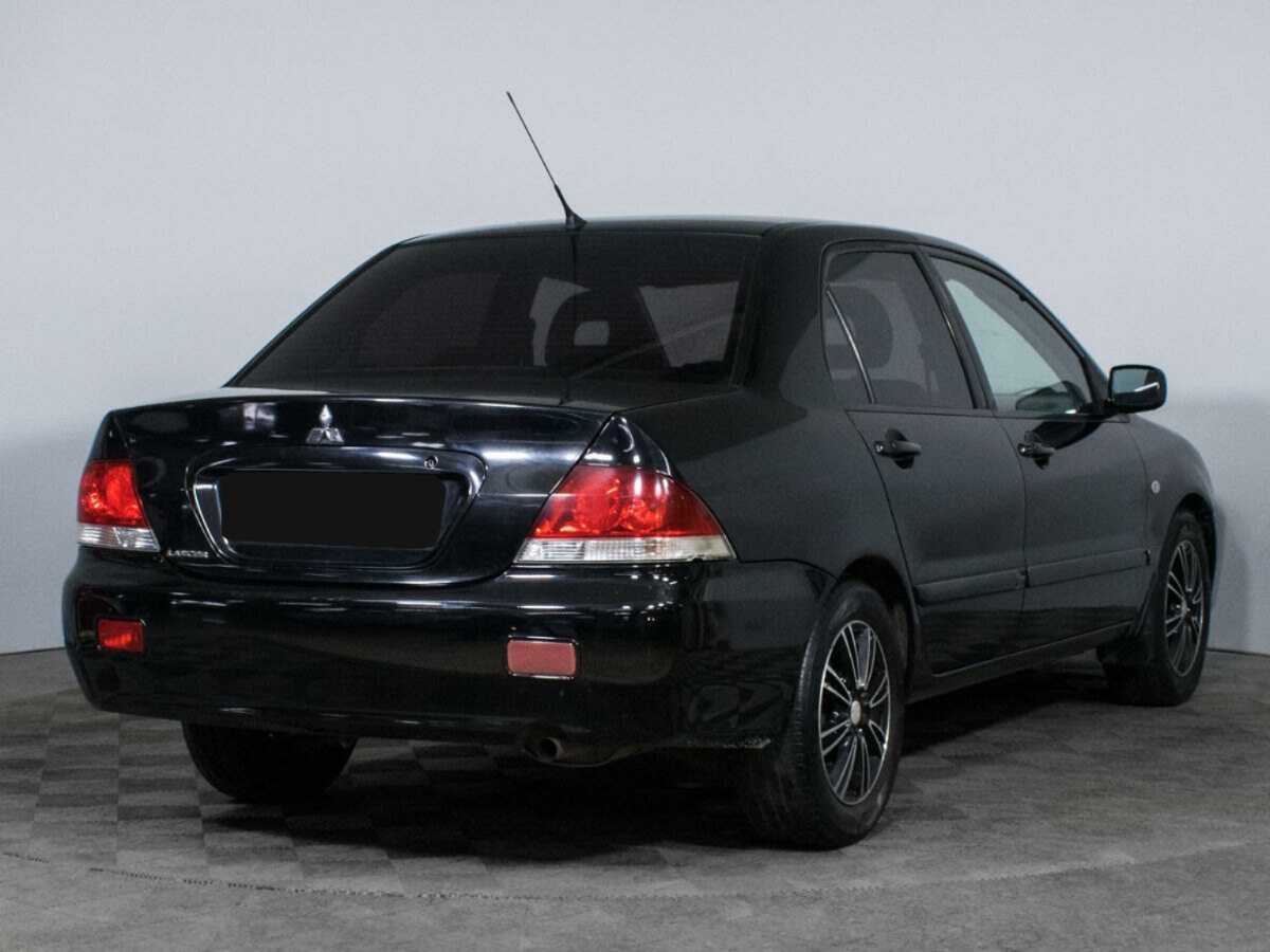 Купить Mitsubishi Lancer с пробегом. Фото: #4