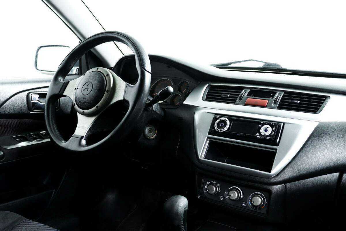 Купить Mitsubishi Lancer с пробегом. Фото: #8