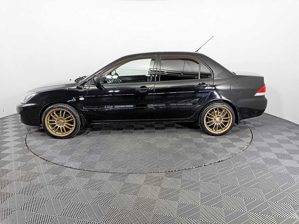 Купить Mitsubishi Lancer с пробегом. Фото: #7