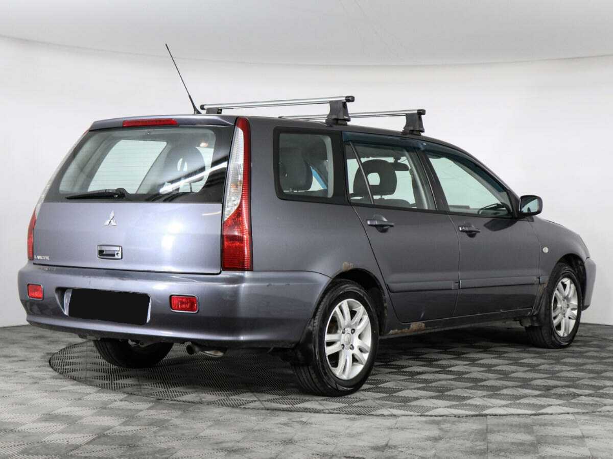 Купить Mitsubishi Lancer с пробегом. Фото: #2