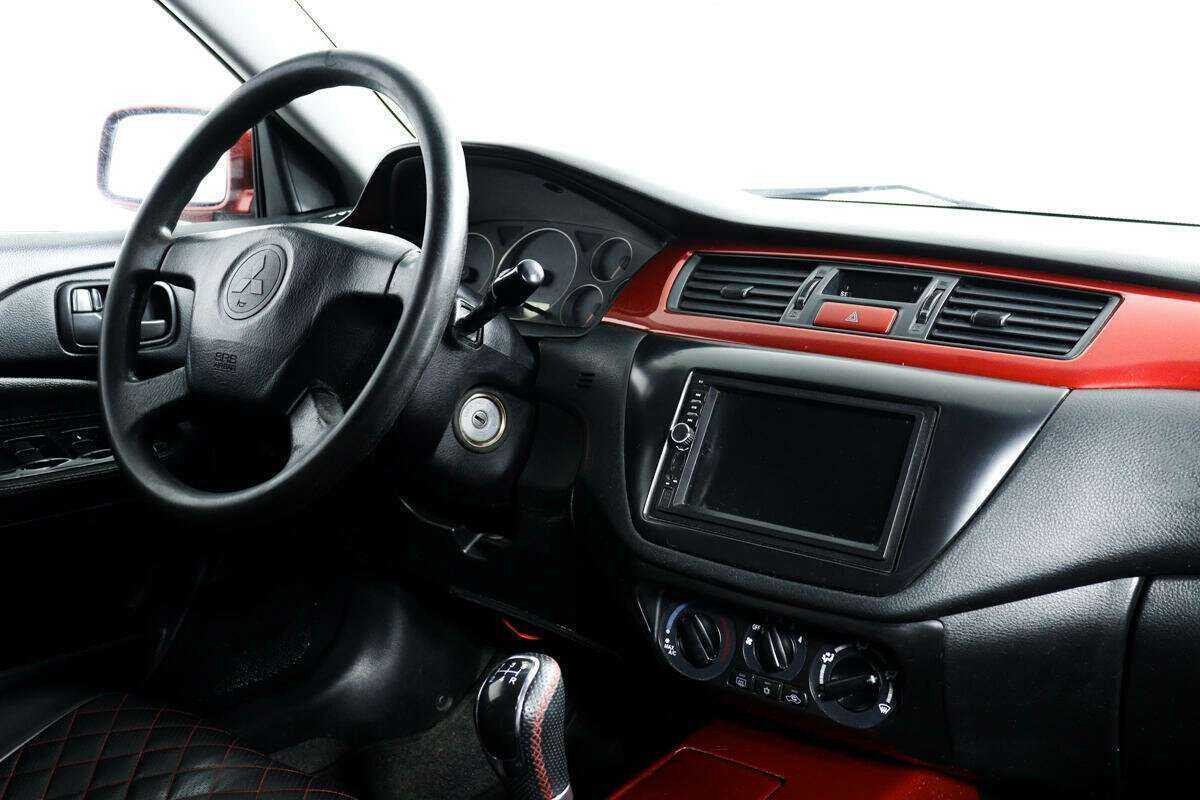 Купить Mitsubishi Lancer с пробегом. Фото: #8