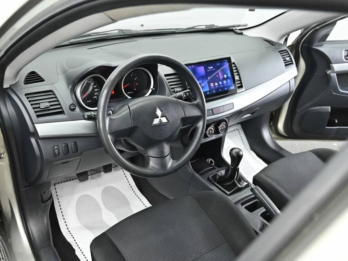 Купить Mitsubishi Lancer с пробегом. Фото: #7