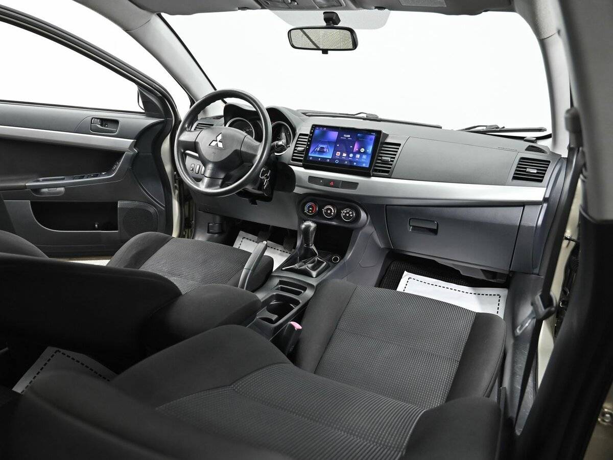 Купить Mitsubishi Lancer с пробегом. Фото: #10