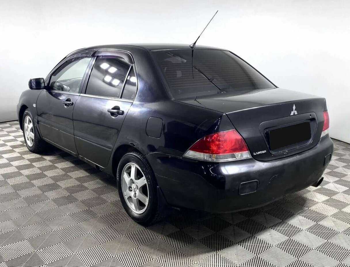 Купить Mitsubishi Lancer с пробегом. Фото: #5