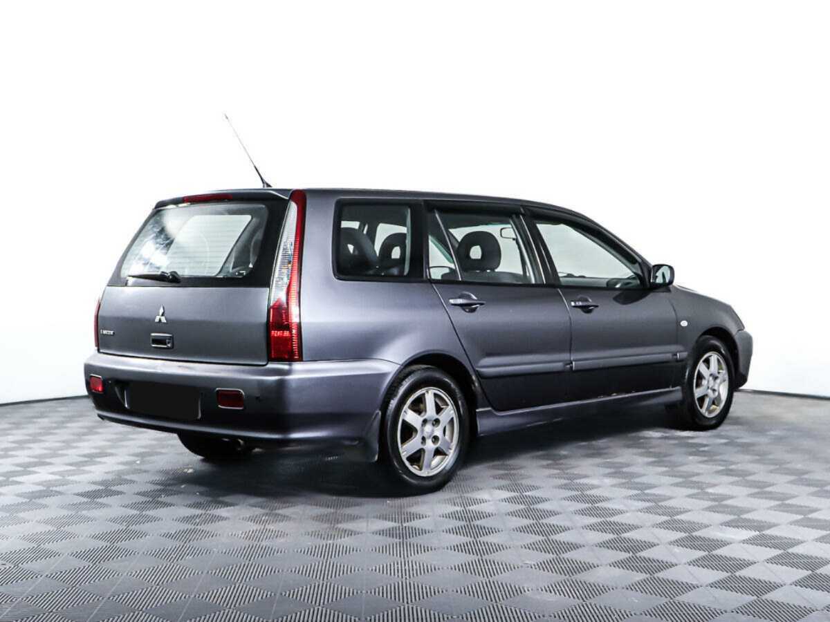 Купить Mitsubishi Lancer с пробегом. Фото: #4