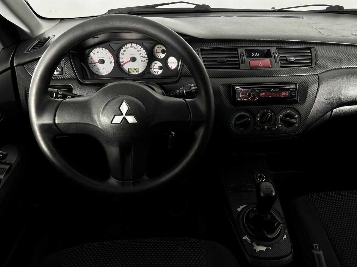 Купить Mitsubishi Lancer с пробегом. Фото: #7