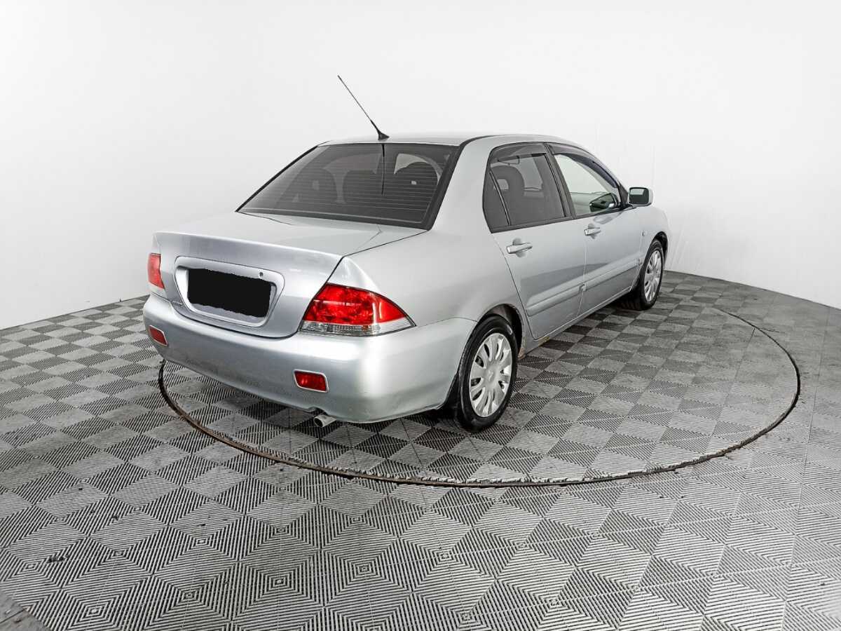 Купить Mitsubishi Lancer с пробегом. Фото: #4