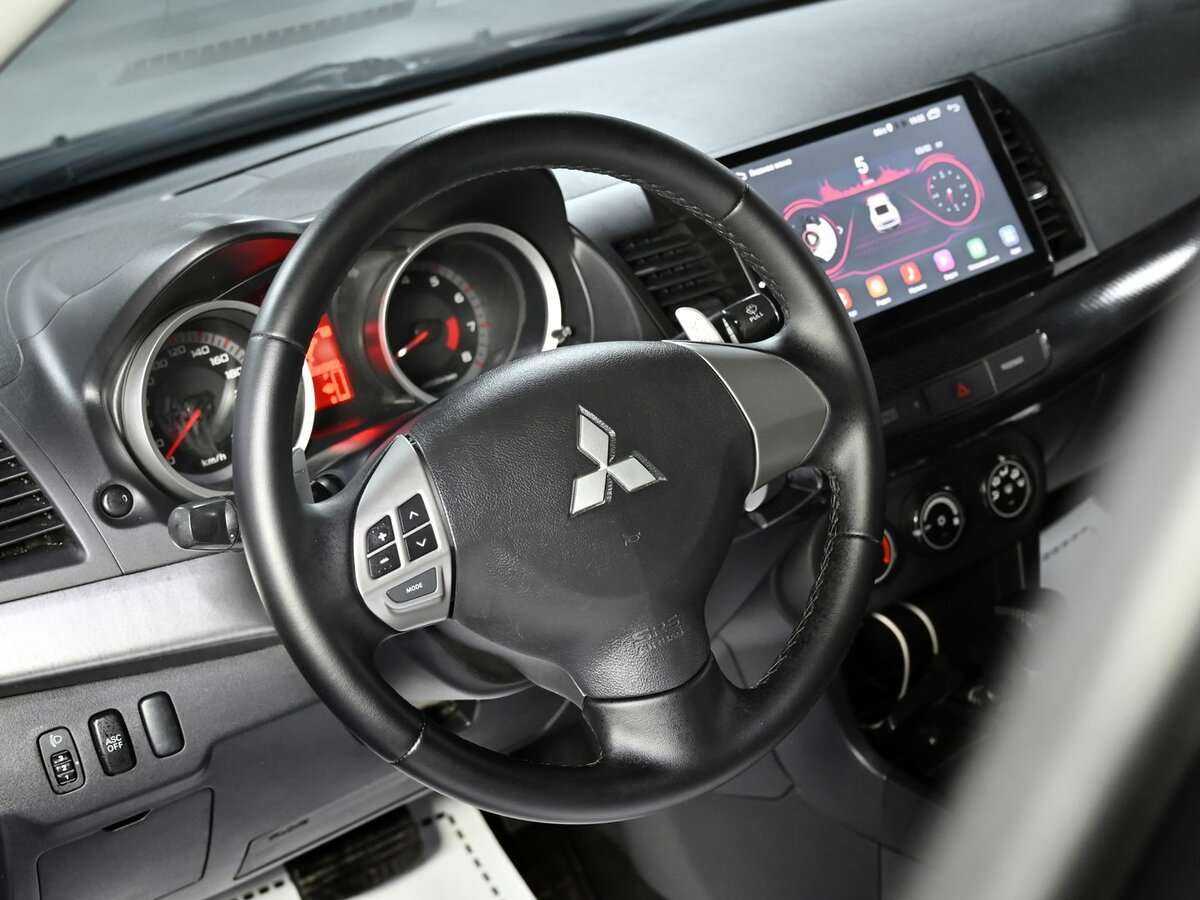 Купить Mitsubishi Lancer с пробегом. Фото: #8