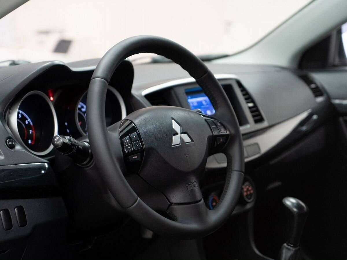 Купить Mitsubishi Lancer с пробегом. Фото: #4