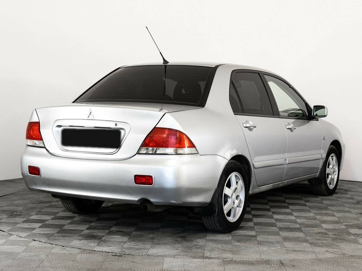 Купить Mitsubishi Lancer с пробегом. Фото: #4