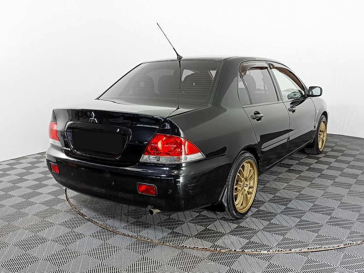 Купить Mitsubishi Lancer с пробегом. Фото: #4