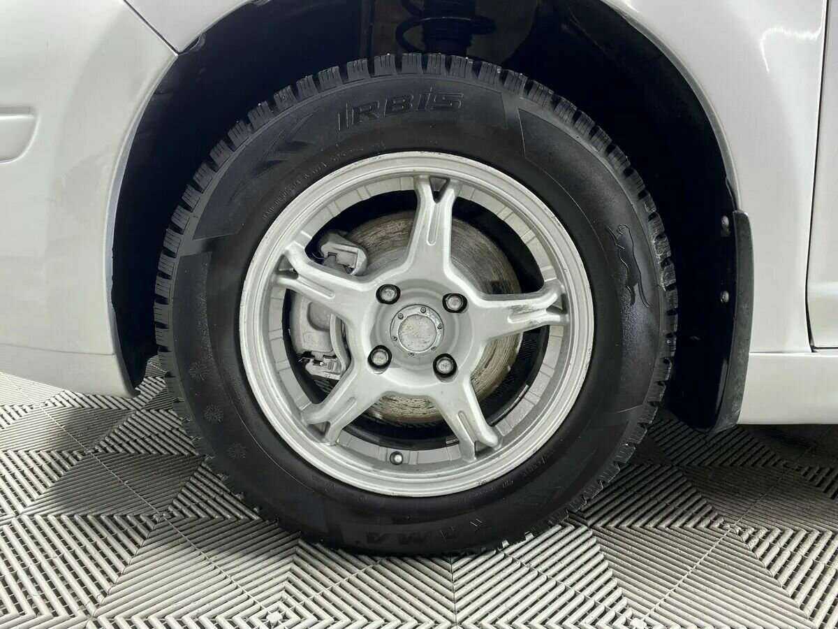 Купить Nissan Tiida с пробегом. Фото: #15