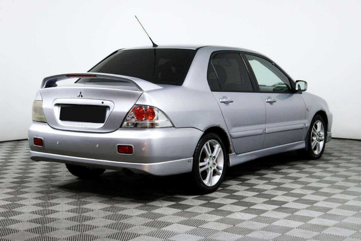 Купить Mitsubishi Lancer с пробегом. Фото: #4