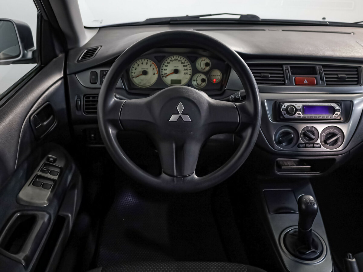 Купить Mitsubishi Lancer с пробегом. Фото: #8