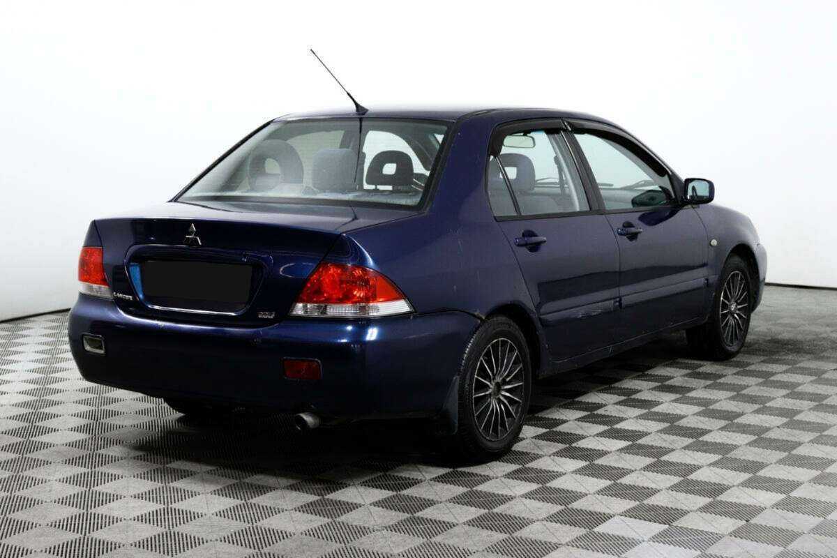 Купить Mitsubishi Lancer с пробегом. Фото: #4