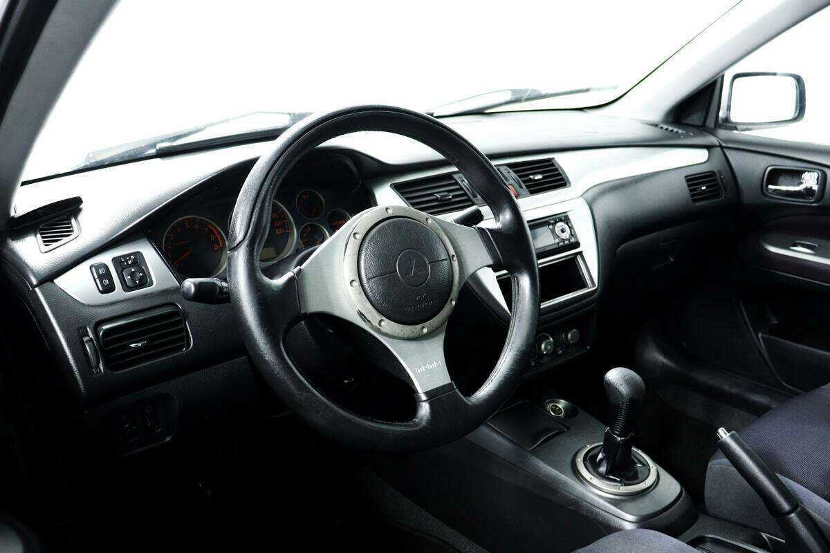 Купить Mitsubishi Lancer с пробегом. Фото: #12