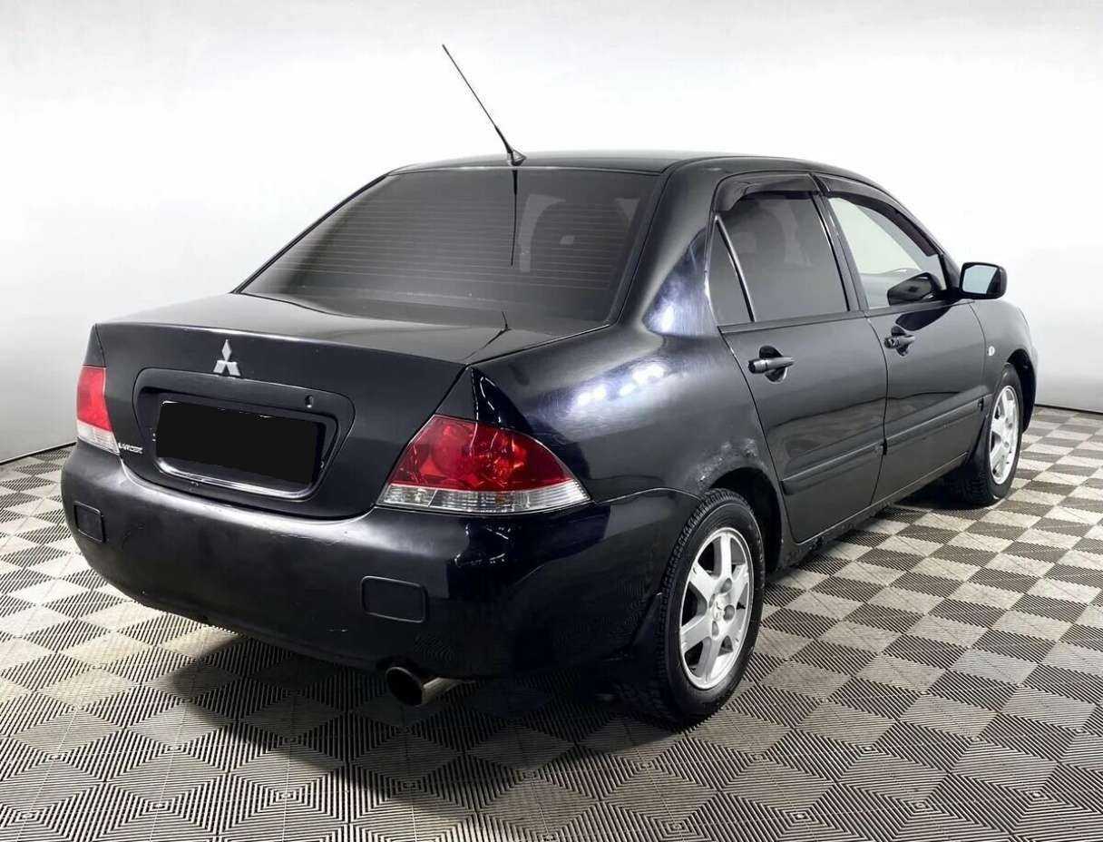 Купить Mitsubishi Lancer с пробегом. Фото: #4