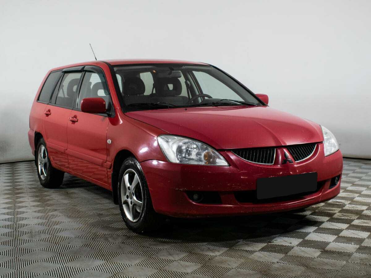 Купить Mitsubishi Lancer с пробегом. Фото: #2