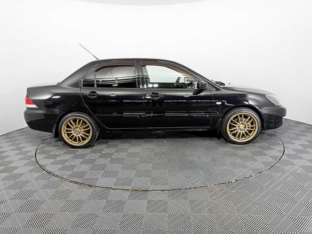 Купить Mitsubishi Lancer с пробегом. Фото: #3
